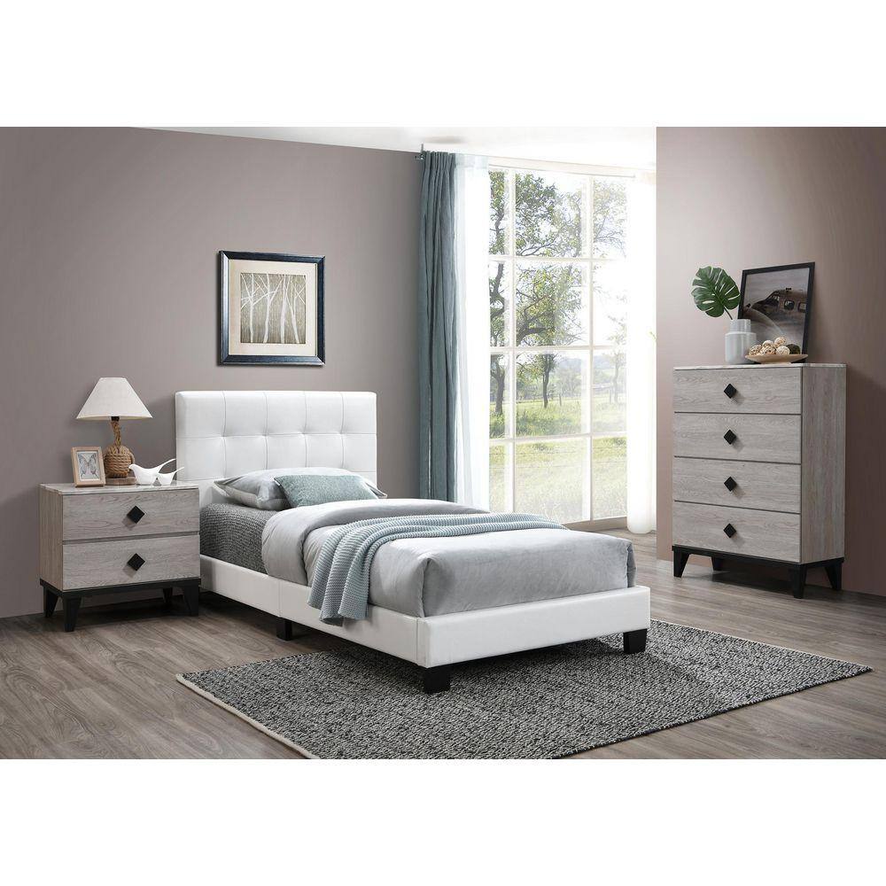 White faux leather upholstered twin bed in a fully furnished bedroom.