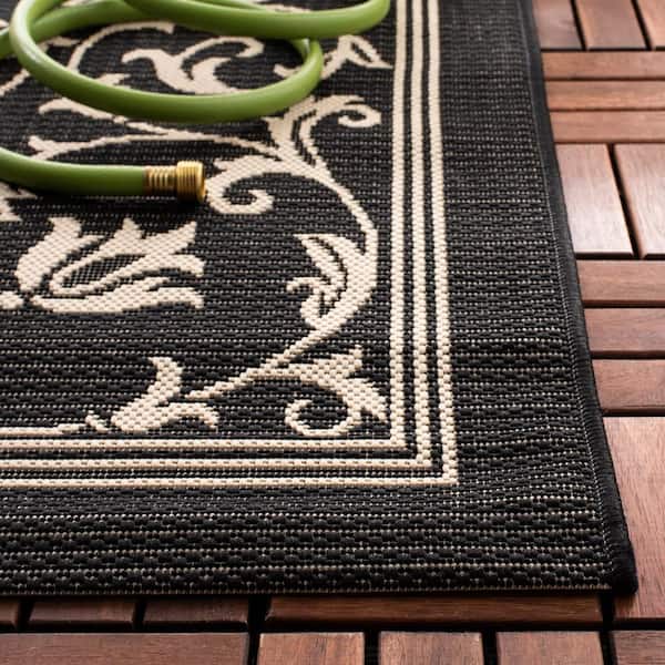 Courtyard Black/Sand 2 ft. x 10 ft. Border Indoor/Outdoor Patio  Runner Rug
