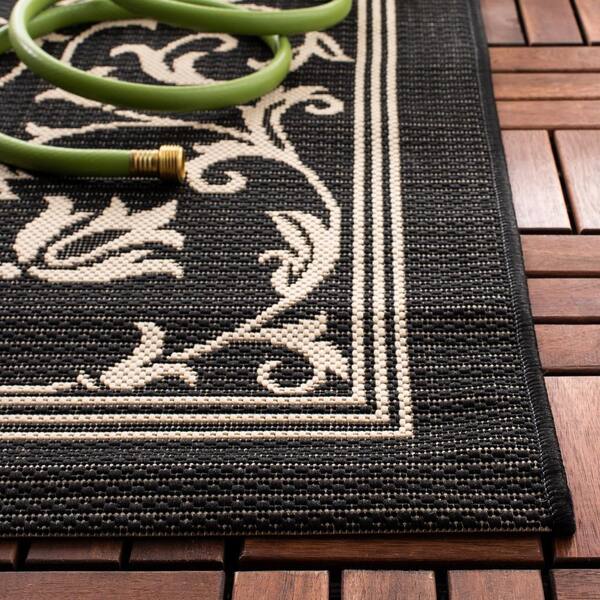Courtyard Black/Sand 2 ft. x 12 ft. Border Indoor/Outdoor Patio  Runner Rug