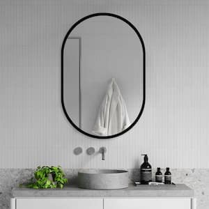 21 in. W x 31 in. H Oval Black Framed Iron Medicine Cabinet with Mirror