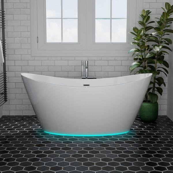 Modern bathroom with freestanding bathtub, modern taps and blue LED ambient  lighting Stock Photo