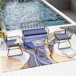 4-Piece Wicker Patio Conversation Set with Blue Cushions and Glass Coffee Table Suitable for patio, garden, balcony