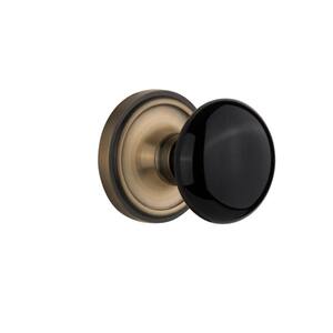 Classic Rosette 2-3/8 in. Backset Antique Brass Privacy Bed/Bath Black Porcelain Door Knob