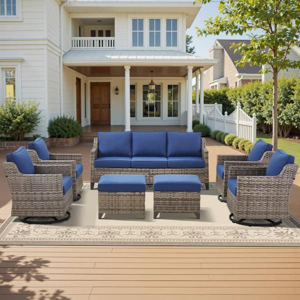 Glissia 7-Piece Gray Wicker Patio Conversation Set with Swivel Gliders and 4 in. Olefin Navy Blue Cushions
