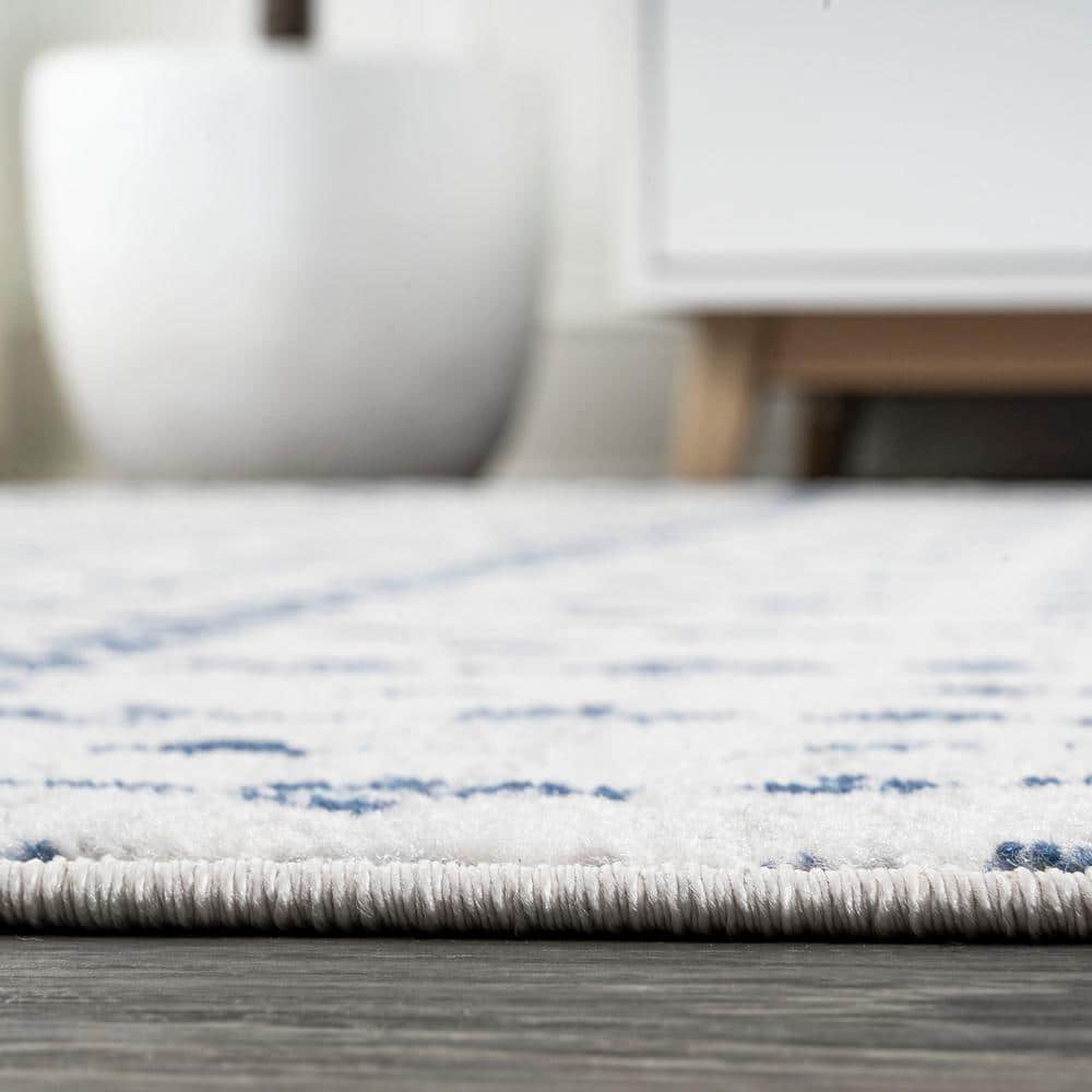 Ivory and Navy 4' x 6' Synthetic Trellis Area Rug