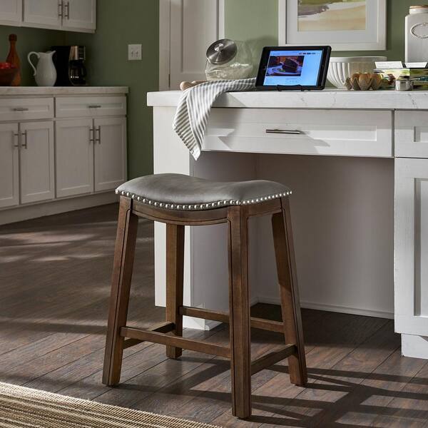HomeSullivan 25.75 in. Grey Faux Leather Saddle Seat Backless Wood Frame Counter Height Stool