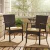Two wicker chairs arranged on a deck with a natural view.