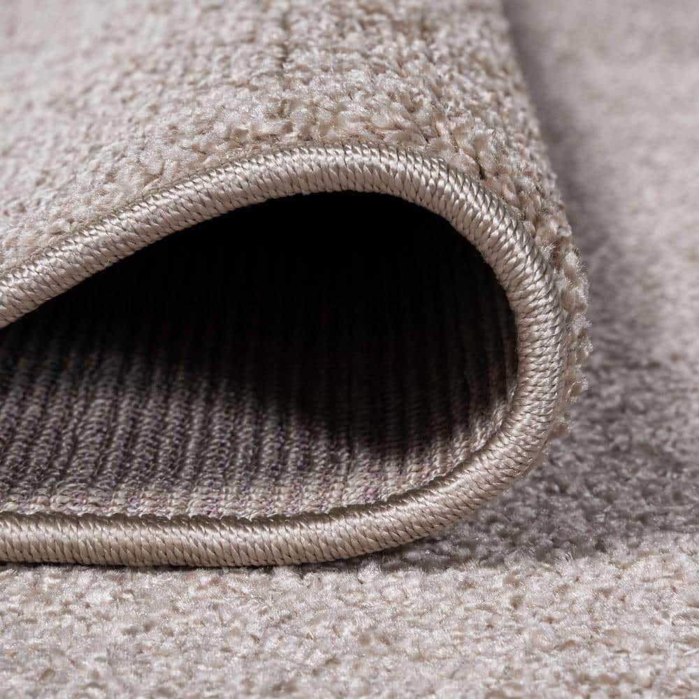 Beige Solid Low-Pile Synthetic Indoor Area Rug