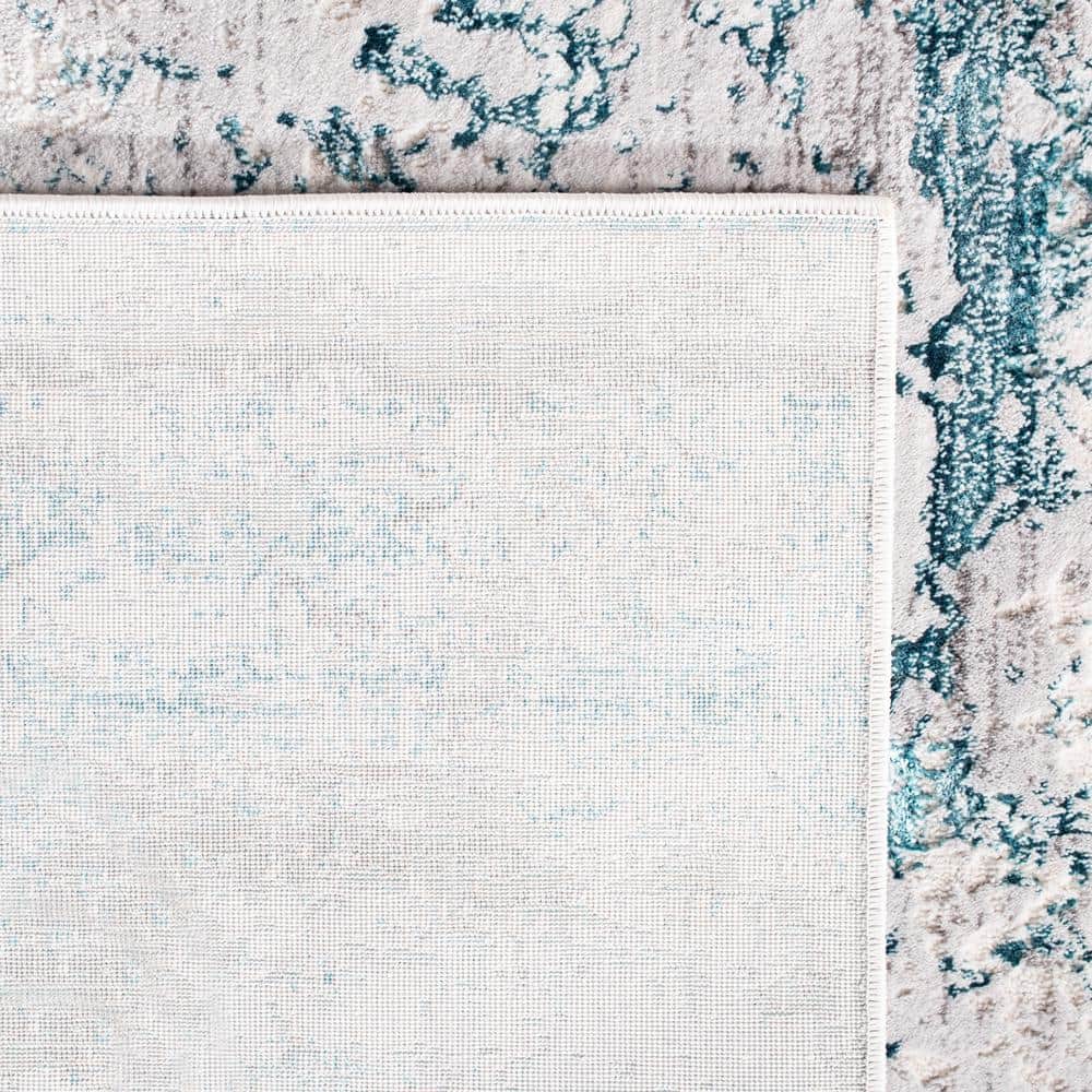 Cream and Turquoise Abstract Rectangular Area Rug 5'3" x 7'6"
