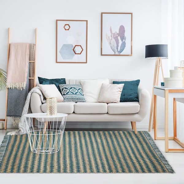 https://images.thdstatic.com/productImages/01442f02-4ae7-410e-9dd8-27c928cee441/svn/teal-superior-area-rugs-5x8rug-chevron-tl-e1_600.jpg