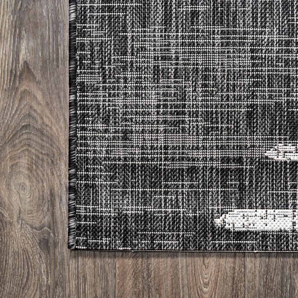 Zolak 4' x 6' Black and Ivory Synthetic Stripe Rug