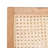 Close-up detail of the woven cane and natural wood frame of the chair.