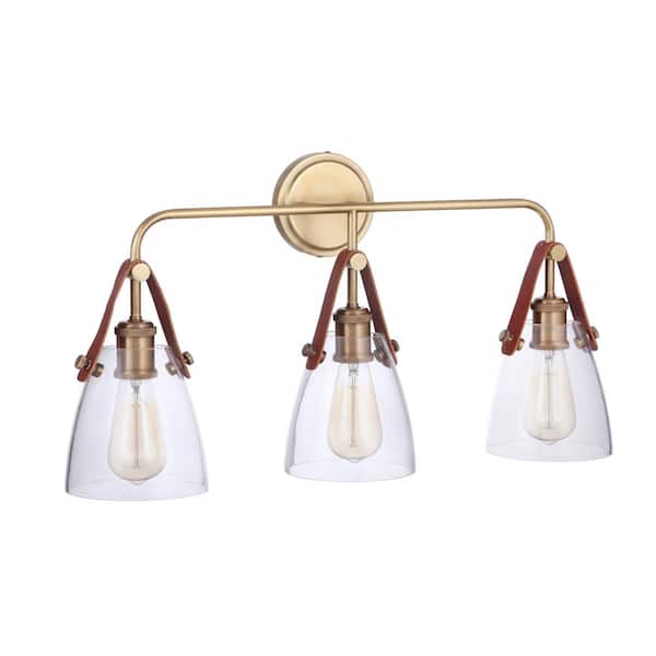 CRAFTMADE Hagen 26 in. 3-Light Vintage Brass Finish Vanity Light with Crystal Clear Glass Suspended from Genuine Leather Strap