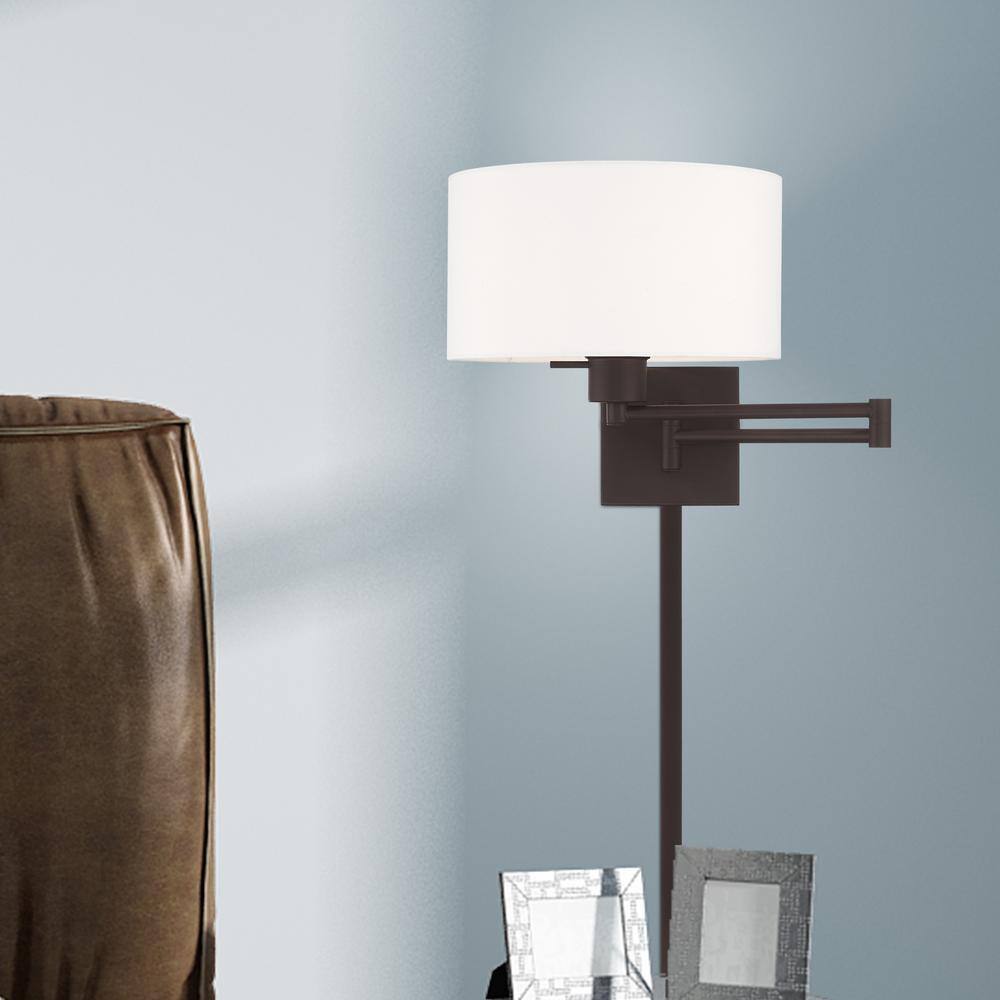 Transitional Bronze Swing Arm Wall Lamp with Off-White Fabric Shade