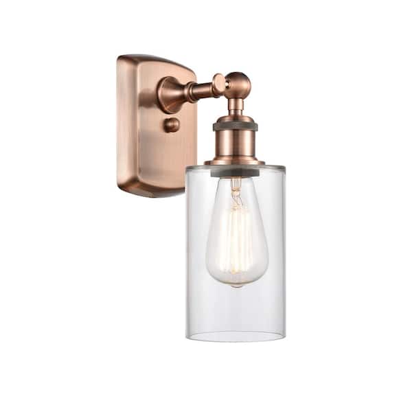 Innovations Clymer 1-Light Antique Copper Wall Sconce with Clear Glass Shade