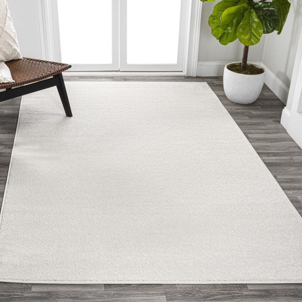 Cream Solid Synthetic Low-Pile Reversible Area Rug 8 x 10