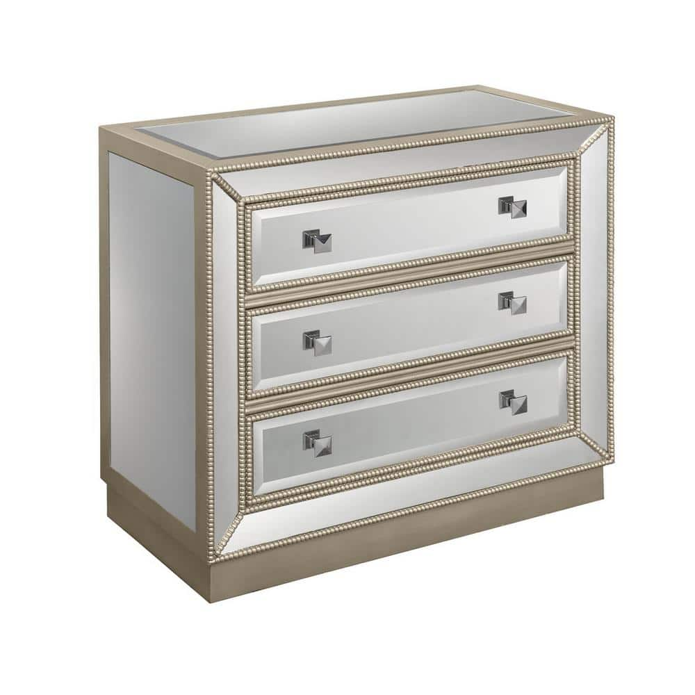 https://images.thdstatic.com/productImages/02574a0a-0c89-40ea-a6c9-d393c21eba1a/svn/estaline-champagne-and-mirror-coast-to-coast-accents-chest-of-drawers-50706-64_1000.jpg