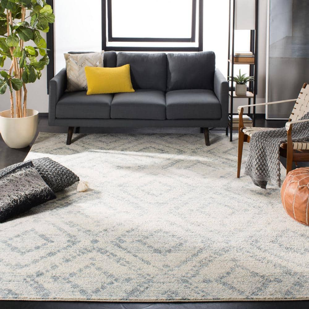 Ivory and Light Blue Geometric 8' x 10' Synthetic Area Rug