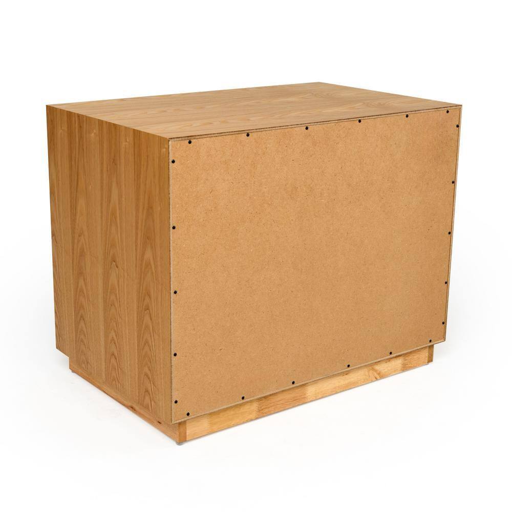 Angled back view of the natural oak nightstand.