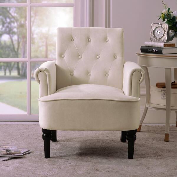 white tufted armchair