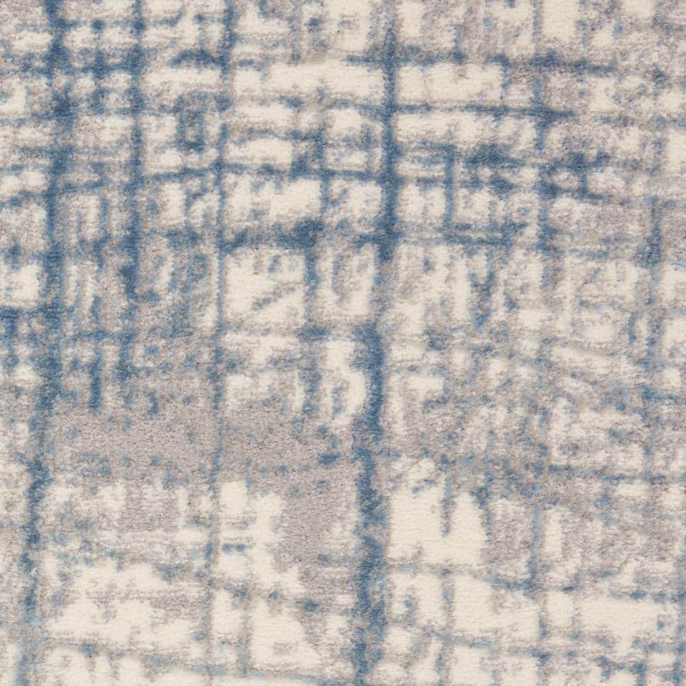 Ivory Blue Abstract 5' x 7' Synthetic Area Rug