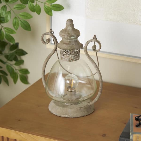 Litton Lane Bronze Metal Decorative Scroll Candle Lantern with Arched Handle
