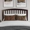 Styled bedroom featuring the wooden headboard and bedding.