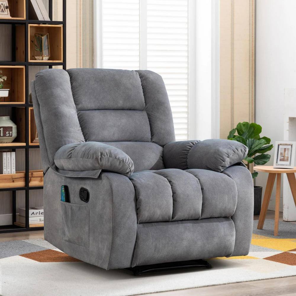 A gray fabric recliner chair in a living room setting.