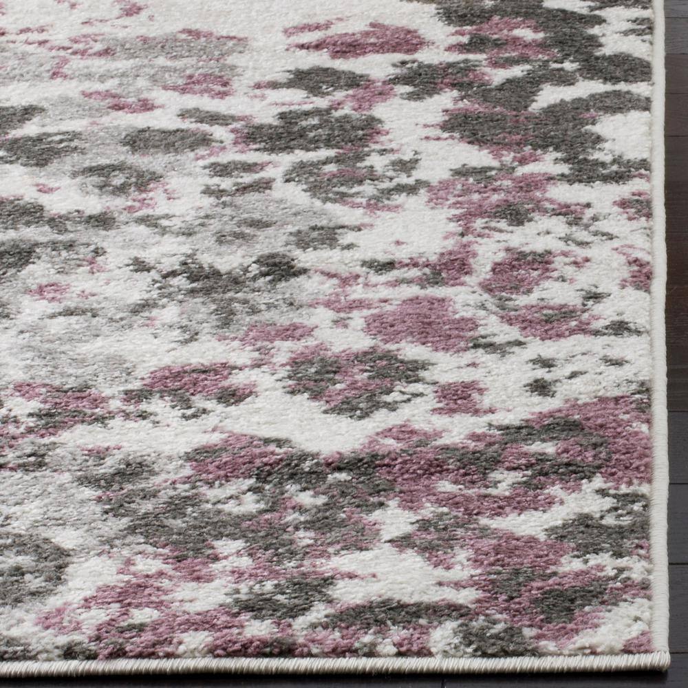 Ivory and Purple Floral Synthetic 8' x 10' Area Rug