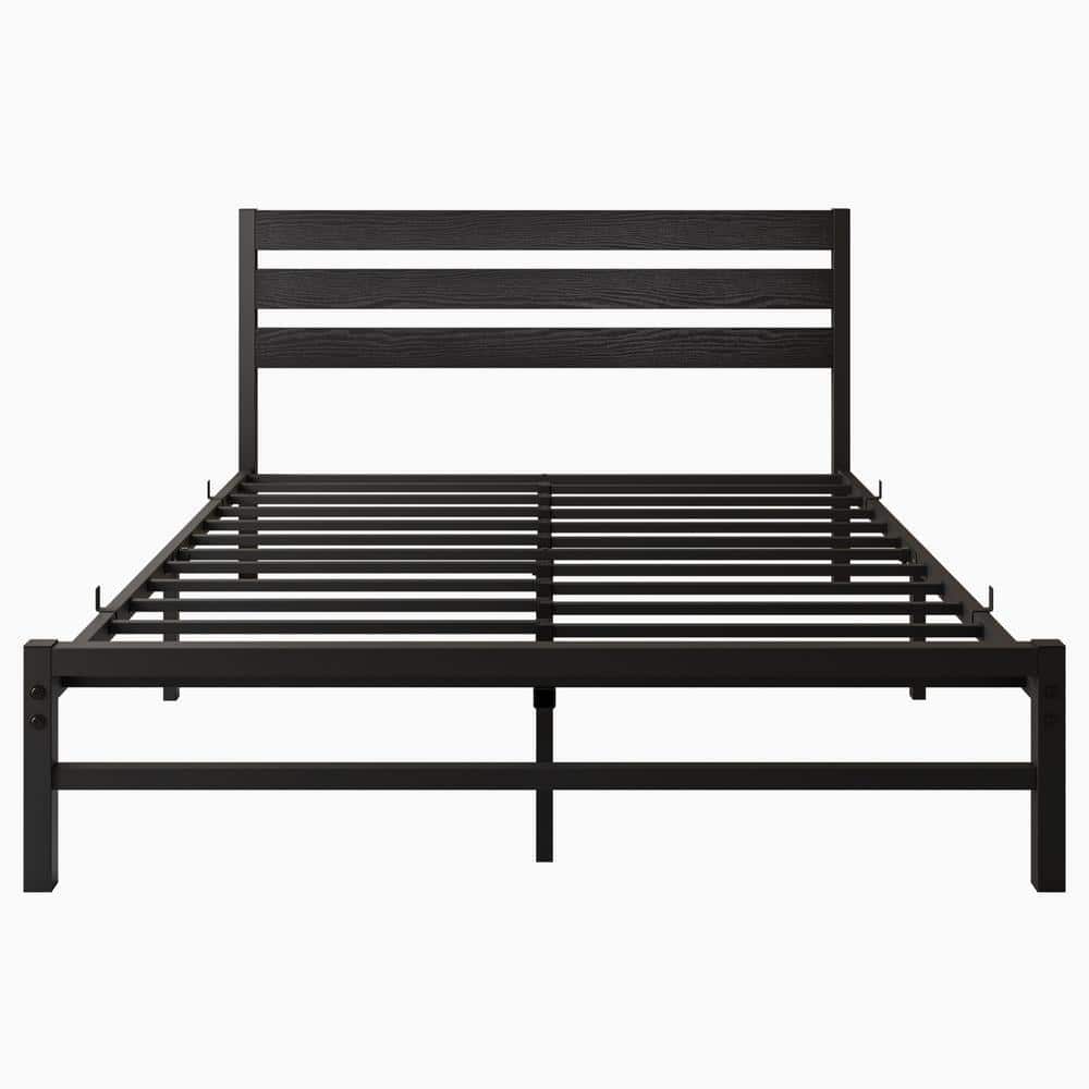 Black metal frame queen platform bed with a wooden headboard.