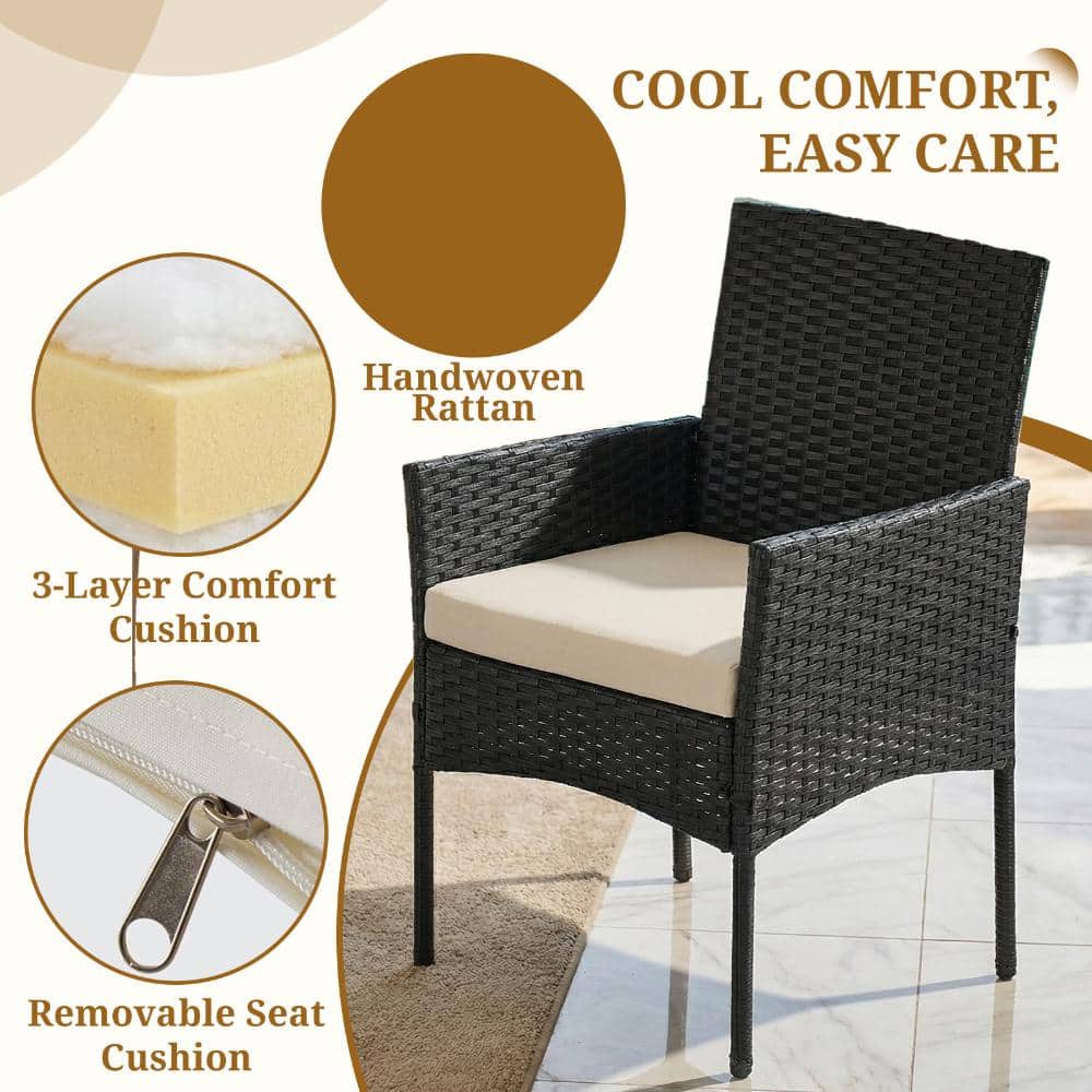 Detail view of the black wicker chair and its white cushion.