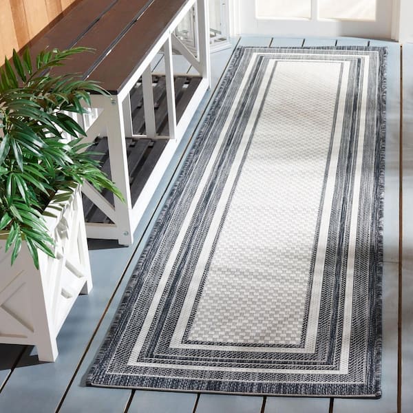 Courtyard Ivory/Black 2 ft. x 7 ft. Solid Color Striped Indoor/Outdoor Runner Rug