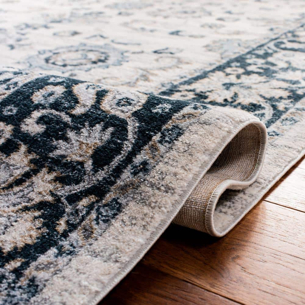 Isabella Cream and Navy 4' x 6' Synthetic Oriental Area Rug