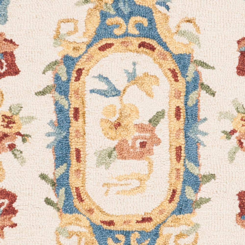 Handmade Cream and Blue Floral Wool Area Rug