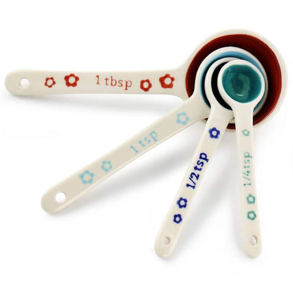 https://images.thdstatic.com/productImages/03ca0e21-4f1a-4f5c-a297-d300671ae5ed/svn/white-gibson-home-measuring-cups-measuring-spoons-985118956m-c3_600.jpg