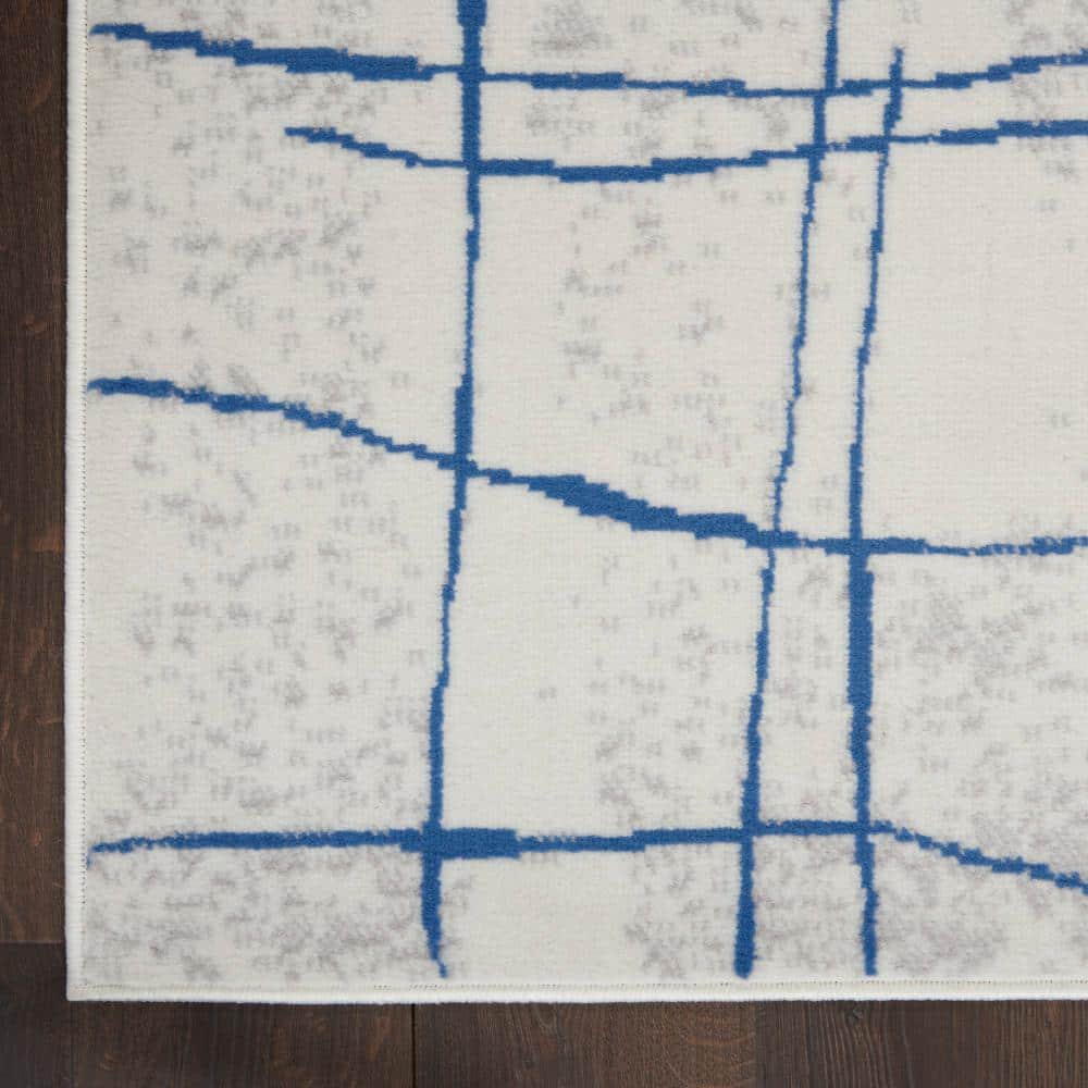 Ivory Abstract Linear 6' x 9' Machine-Made Synthetic Area Rug