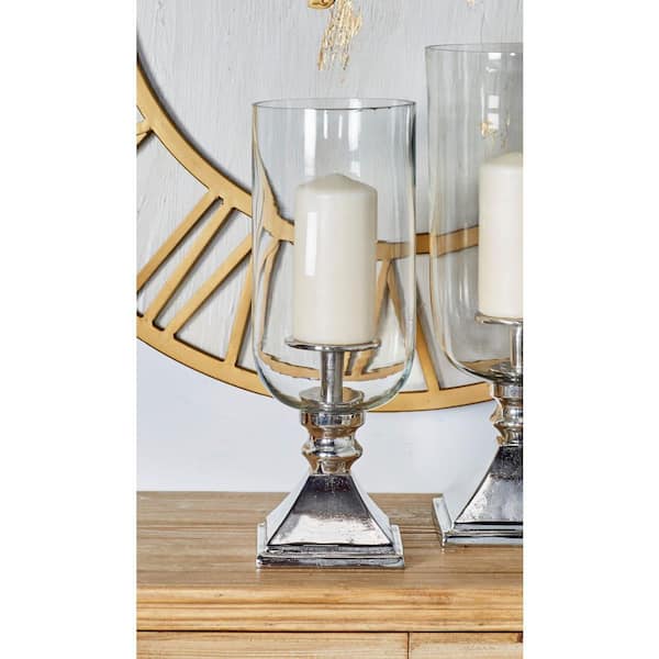 https://images.thdstatic.com/productImages/044a4e78-15af-4e04-9015-6892a3c88daa/svn/silver-litton-lane-candle-holders-20172-31_600.jpg