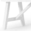 Close-up of the white frame structure of the dining table.