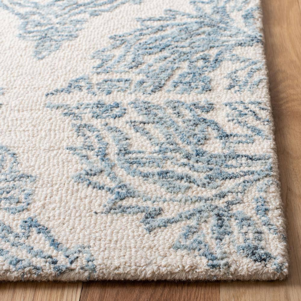 Ivory and Blue Handmade Tufted Wool Abstract Rug