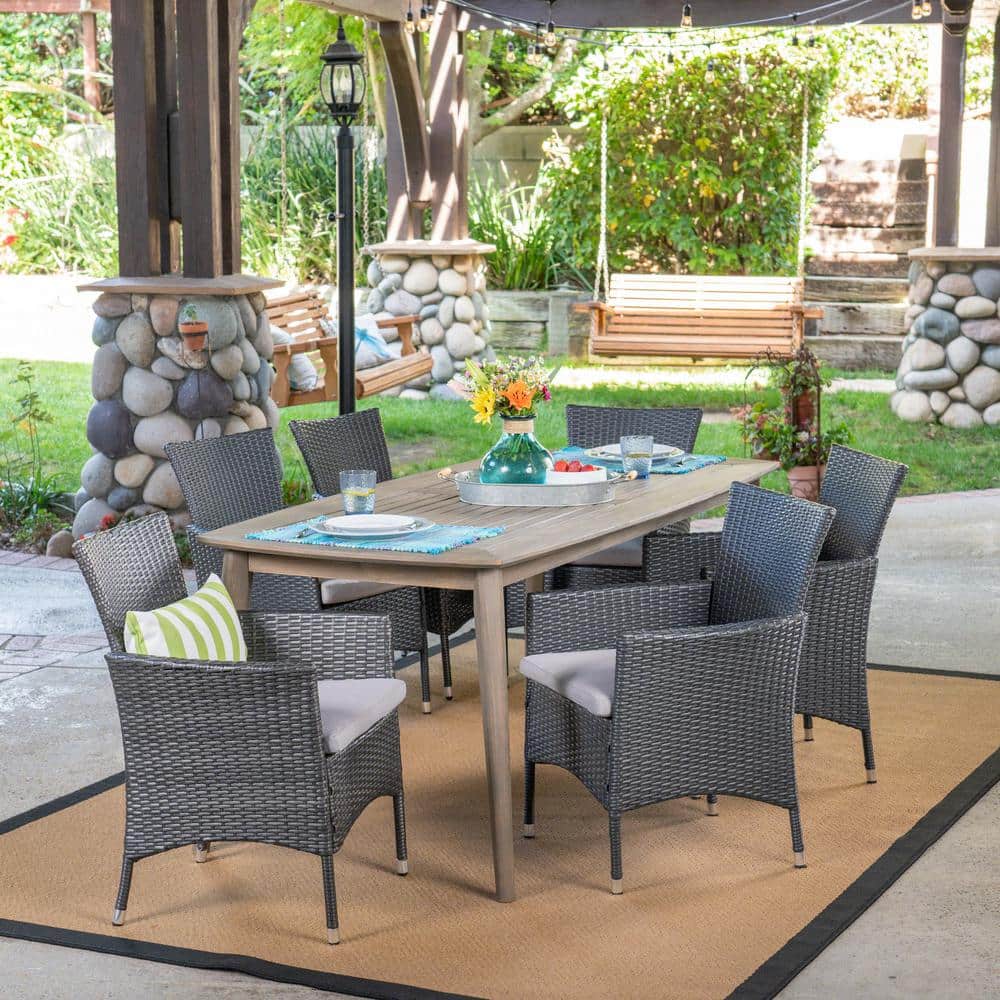 Noble House Macy Grey 7-Piece Faux Rattan Outdoor Dining Set with Stacking  Chairs 21190 - The Home Depot