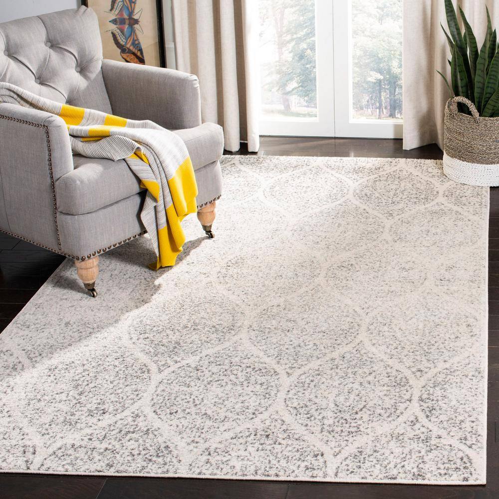 Ivory and Silver Geometric 8' x 10' Synthetic Area Rug