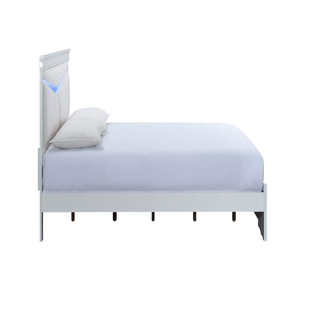 White wood frame king panel bed with headboard and mattress.