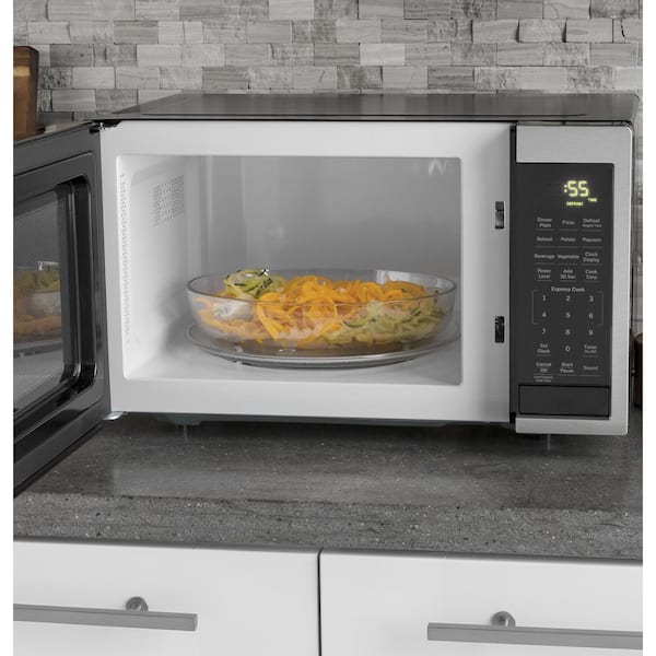 https://images.thdstatic.com/productImages/0603b64a-8a7c-44f2-ba74-76c6c9220196/svn/stainless-steel-ge-countertop-microwaves-jes1095smss-1d_600.jpg
