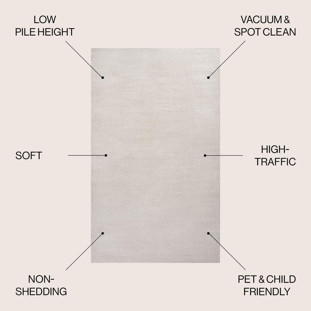 Ivory Solid Synthetic 10' x 14' Reversible Area Rug