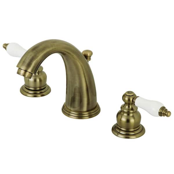 Kingston Brass Victorian 2-Handle 8 in. Widespread Bathroom Faucets with Plastic Pop-Up in Antique Brass