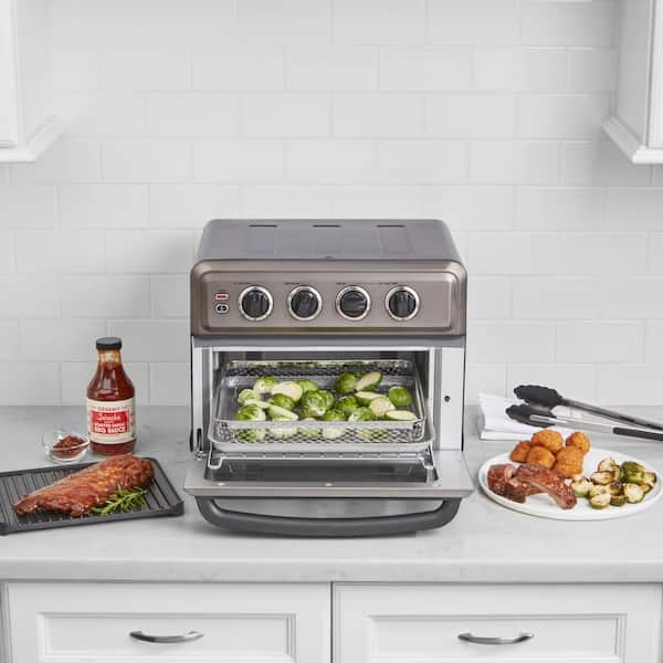 https://images.thdstatic.com/productImages/06b35dc9-f90a-4104-a93c-04bd4a99e247/svn/stainless-steel-cuisinart-toaster-ovens-toa-70bks-31_600.jpg