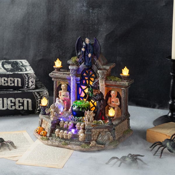 Glitzhome 9.75 in. H Lighted Resin Halloween Haunted House Village