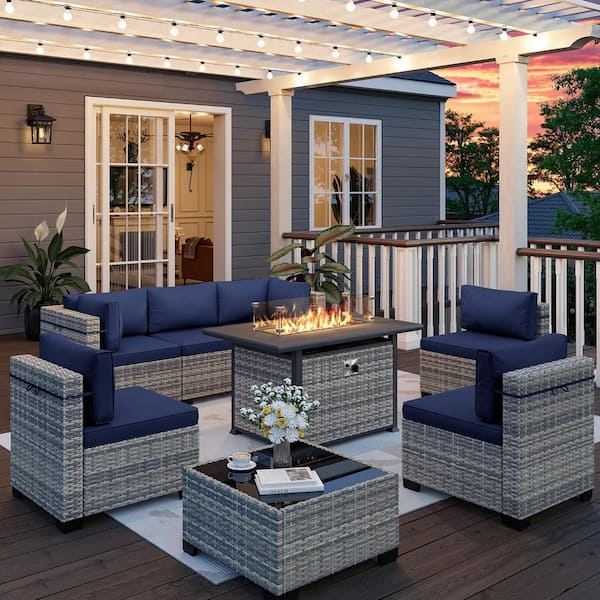 8-Piece Wicker Patio Conversation Set with 55,000 BTU Fire Pit Table and Glass Top Table with Navy Blue Cushions