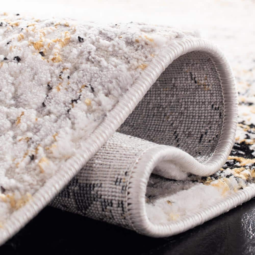 Cream and Gold Abstract 4' x 6' Stain-Resistant Area Rug