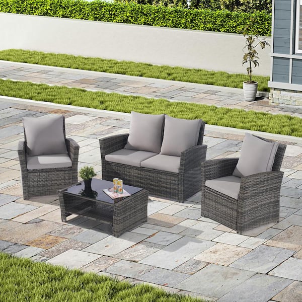 Gilati 4-Piece Wicker Outdoor Patio Conversation Set with Thick Light Gray Cushion and Tempered Glass Coffee Table